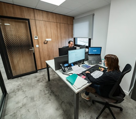 Modern office workspace with professionals working